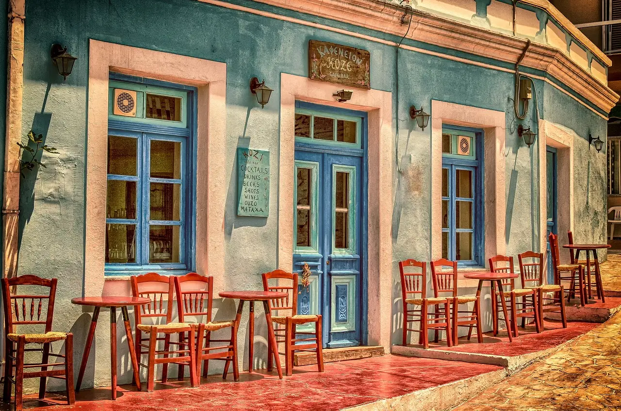 A well-kept storefront with clean windows and warm lights visible at dusk